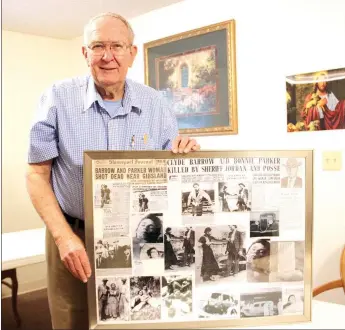  ?? LYNN KUTTER ENTERPRISE-LEADER ?? The Rev. Donald Doughty, of Farmington, has collected articles, photos and other memorabili­a about the Depression-era outlaws, Bonnie and Clyde. He shows a display he created with some of his materials. Doughty became interested in the couple while...