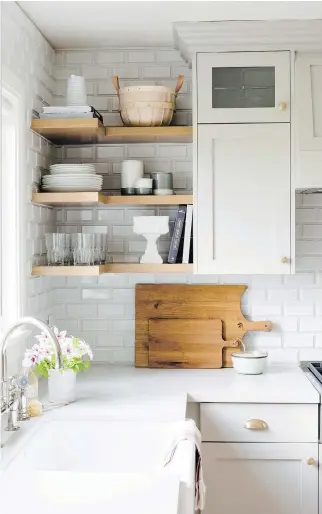  ?? JESSICA WHITE PHOTOGRAPH­Y ?? You can add dimension to standard subway tile by using ceramic tile with a bevelled edge.