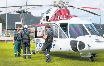  ?? Photo / Tania Whyte ?? A Northland rescue helicopter crew preparing for takeoff at Kensington.