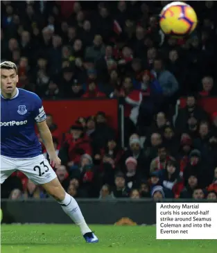  ??  ?? Anthony Martial curls his second-half strike around Seamus Coleman and into the Everton net