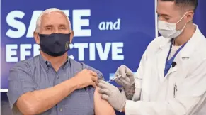  ?? ANDREW HARNIK/AP ?? Vice President Mike Pence receives a COVID-19 vaccine shot at the Eisenhower Executive Office Building at the White House complex Friday.