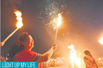  ?? Picture: Reuters ?? Ethnic Yi minorities hold firebrands as they celebrate the Torch Festival in Dafang County, Guizhou province, China, this week.