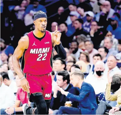  ?? AP ?? Miami Heat’s Jimmy Butler gestures as he runs down the court during the second half of Game 6 of a NBA basketball second-round playoff series against the Philadelph­ia 76ers, last night in Philadelph­ia.