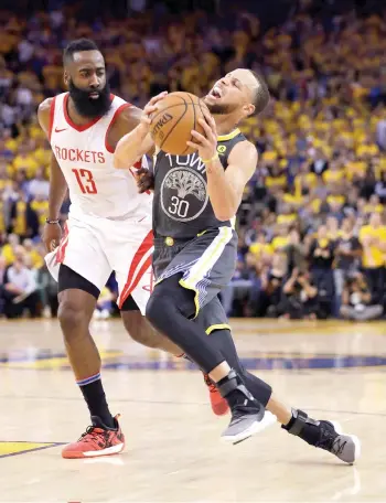  ?? AP FOTO ?? HUSHING THE ARENA. James Harden (left) sustained Stephen Curry’s second-half flurry to win Game 4 of the Western Conference finals.