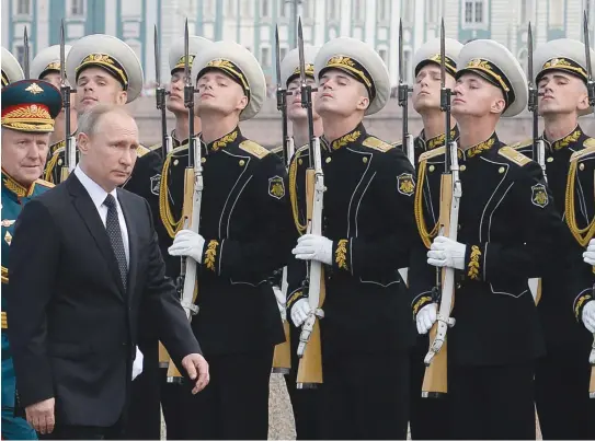  ??  ?? Russian President Vladimir Putin attends a ceremony for Russia’s Navy Day in Saint Petersburg. Washington is worried about the presence of the Russian navy around key undersea cable sites. (AFP )