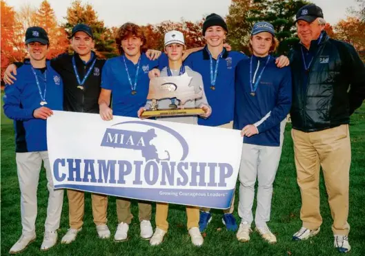  ?? MATTHEW J. LEE/GLOBE STAFF ?? Individual winner Charlie Potter (with trophy) helped Dover-Sherborn capture its first championsh­ip in Division 2.