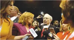  ??  ?? OMAHA: Berkshire Hathaway Chairman and CEO Warren Buffett tours the exhibit floor before presiding over the annual shareholde­rs meeting in Omaha, Neb. Berkshire Hathaway reported financial results on Friday. —AP