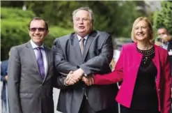  ??  ?? CRANS-MONTANA: (Left to right) UN envoy Espen Barth Eide, Greek Foreign Minister Nikos Kotzias and head of the United Nations Peacekeepi­ng Force in Cyprus (UNFICYP) Elizabeth Spehar pose for a picture at the opening of Cyprus peace talks yesterday in...