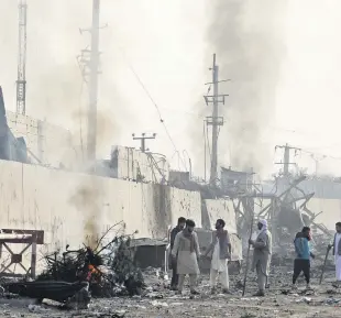  ??  ?? Angry protesters burn tyres at the site of a blast in Kabul, Afghanista­n on Sept. 3, 2019.