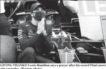  ??  ?? GIVING THANKS! Lewis Hamilton says a prayer after his record 92nd career win yesterday. (Reuters photo)