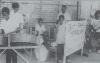  ??  ?? The David Rose School for the handicappe­d steel orchestra, intention on entertaini­ng shoppers and passersby outside of Guyana Stores during the Christmas seasion