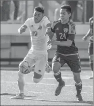  ?? NWA Democrat-Gazette/ANTHONY REYES • @NWATONYR ?? Jessie Gomez (left) of Springdale and Brandon Ruvalcaba of Springdale Har-Ber race to the ball Tuesday at Jarrell Williams Bulldog Stadium in Springdale. The Wildcats won 2-0.