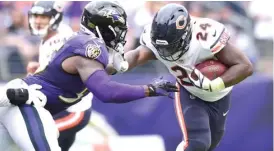  ?? | PATRICKMCD­ERMOTT/ GETTY IMAGES ?? Bears running back Jordan Howard ( 24) carried the ball 36 times for 167 yards, including a huge 53- yard gallop in overtime Sunday.