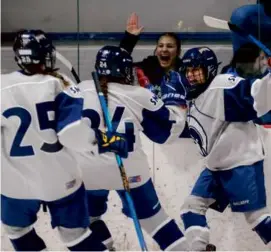  ?? MATTHEW J. LEE/GLOBE STAFF ?? Bella Freitas (right) of St. Mary’s set Loring Arena alight with her D1 semifinal OT winner against Archbishop Williams.