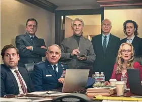  ?? Niko Tavernise/Associated Press ?? Mark Rylance as Peter Isherwell, standing center, with main cast members, seated from left, Jonah Hill, Paul Guilfoyle and Meryl Streep in a scene from “Don’t Look Up.”