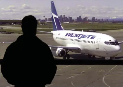  ?? ADRIAN WYLD, THE CANADIAN PRESS ?? WestJet Airlines Ltd. says it plans to launch a new cheap airline later this year.