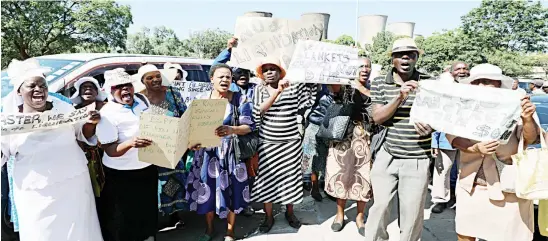  ??  ?? National Blankets workers hold a demonstrat­ion over their remunerati­on at Government’s Mhlahlandl­ela Complex in Bulawayo yesterday. (Picture by Dennis Mudzamiri)