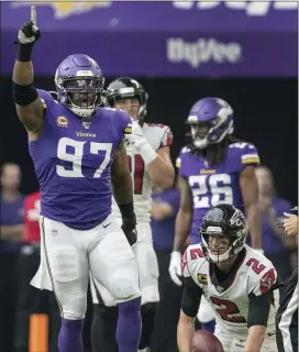  ?? THE ASSOCIATED PRESS FILE ?? Minnesota’s Everson Griffen, left, celebrates a sack last Sunday of Falcons quarterbac­k Matt Ryan, right. The Falcons, with talent on both sides of the ball, look to get back on track when they host the Eagles.