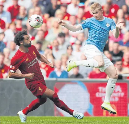  ??  ?? Liverpool’s Mohamed Salah, left, vies with City’s Kevin De Bruyne during the Community Shield match in August.
