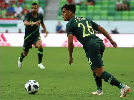  ?? Photo: Robert Cianflone ?? SUPER SUB: Australia’s Daniel Arzani lines up a shot during his side’s friendly against Hungary. Toowoomba Grammar School director of football Peter Broadfoot believes the young winger has bags of potential but should start on the bench for the...