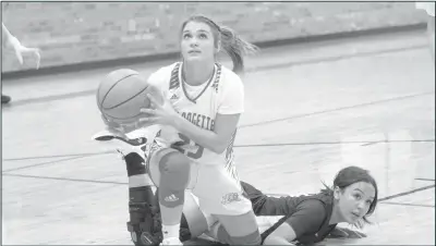  ?? Courtesy Photo ?? Madison Rodgers tries to get a shot off after recovering the ball from an Andrews Lady Mustang player during the Coahoma home varsity game held on Tuesday, Sept. 9, 2021. The Bulldogett­es opened the season with a 33-28 win against 4A Andrews.