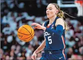  ?? NELL REDMOND/AP PHOTO ?? UConn guard Paige Bueckers brings the ball up court during a game on Feb. 11 against South Carolina in Columbia, S.C.