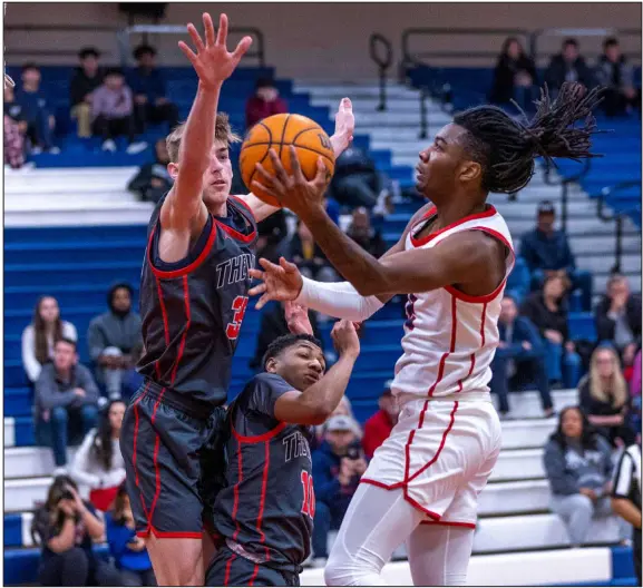  ?? L.E. Baskow Las Vegas Review Journal @Left_eye_images ?? Coronado’s Sebastian Mack looks to score as Arbor View’s Wyatt Jaeck defends. Mack had a game-high 32 points for the Cougars.