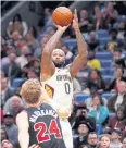  ?? AP ?? Pelicans’ DeMarcus Cousins shoots over Bulls’ Lauri Markkanen.