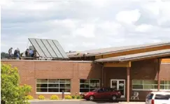  ??  ?? Gundersen Health System’s green efforts include solar panels, like these being installed at its Onalaska Renal Dialysis Center. Its environmen­tal efforts have lowered carbon dioxide emissions by 80% over a decade. “Those are real environmen­tal improvemen­ts that will improve the health of our community,” CEO Dr. Scott Rathgaber said.