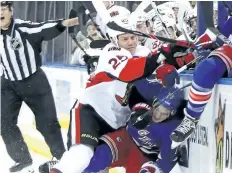  ?? BRUCE BENNETT/GETTY IMAGES ?? Ottawa’s Chris Neil hits New York’s Brady Skjei during a game in December.