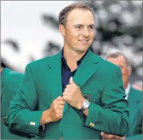  ?? AP PHOTO ?? In this April 12, 2015, file photo, Jordan Spieth wears his green jacket after winning the Masters golf tournament in Augusta, Ga.