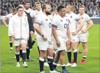  ??  ?? England players show their dejection at full time