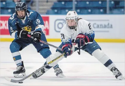  ?? LIAM RICHARDS THE CANADIAN PRESS ?? U.S. forward Hilary Knight, right, is one American player who chose to play in the Canadian Women’s Hockey League this season.