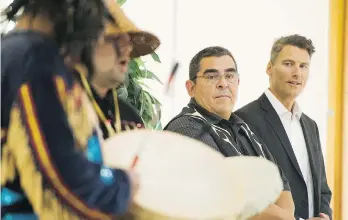  ?? GERRY KAHRMANN ?? Chief Wayne Sparrow, centre, with Mayor Gregor Robertson at the Musqueam Cultural Education and Resource Centre on Tuesday, says his community has a strong tie with the Marpole Midden lands.