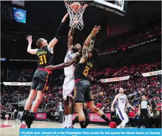  ??  ?? ATLANTA: Amir Johnson #5 of the Philadelph­ia 76ers shoots the ball against the Atlanta Hawks on Tuesday at Philips Arena in Atlanta, Georgia. — AFP