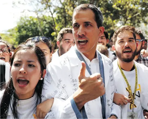  ?? CARLOS GARCIA RAWLINS / REUTERS ?? Juan Guaido, Venezuelan opposition leader and self-proclaimed interim president, takes part in a protest against President Nicolas Maduro’s government outside a hospital in Caracas on Wednesday.