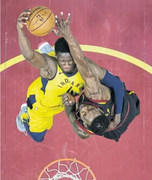  ?? TONY DEJAK/THE ASSOCIATED PRESS ?? The Cleveland Cavaliers’ Jeff Green, right, blocks a shot by Indiana Pacers’ Victor Oladipo in the second half in Cleveland on Sunday. Olapido had 30 points for the Pacers in a losing cause.