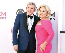  ?? Photo by Jordan Strauss/Invision/AP, File ?? This April 2017 photo shows Todd Chrisley, left, and his wife Julie Chrisley at the 52nd annual Academy of Country Music Awards in Las Vegas. A federal trial for reality television stars on charges including bank fraud and tax evasion is set to start Monday in Atlanta.