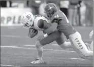  ?? AP/ANDRES LEIGHTON ?? Arizona quarterbac­k Anu Solomon ( left) pushes his way to the end zone to score a touchdown while New Mexico safety Daniel Henry tries to make a tackle Saturday during the first half of the Wildcats’ 45-37 victory over the Lobos at the New Mexico Bowl...