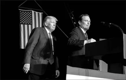  ?? JOSÉ LUIS VILLEGAS / ASSOCIATED PRESS ?? Adam Laxalt, right, the Republican candidate for U.S. Senate, appears with former President Donald Trump Oct. 8 at a rally in Minden.