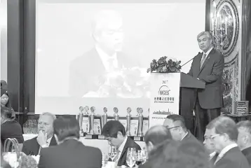  ??  ?? Ahmad Zahid delivers his keynote address at the 9th World Chinese Economic Summit (WCES), a major internatio­nal event aimed at enhancing business relationsh­ips and networks between China and Asean. — Bernama photo