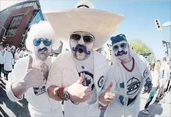  ?? CANADIAN PRESS FILE PHOTO ?? Aaron Wold, Shawn Machado and Jason Krucish make it clear who they’re cheering for before the Jets host the Vegas Golden Knights in Winnipeg on Saturday.