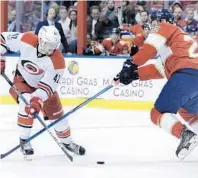  ?? LYNNE SLADKY/AP ?? The Hurricanes’ Joakim Nordstrom, left, the Panthers’ Nick Bjugstad go for the puck during the first period Tuesday at BB&T Center. The game eventually went into overtime.