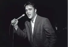  ?? BOB WILLIAMS/ THE COMMERCIAL APPEAL ?? This photo of Elvis Presley performing at Ellis Auditorium on May 15, 1956, is one of many iconic Memphis images captured by photograph­er Bob Williams.