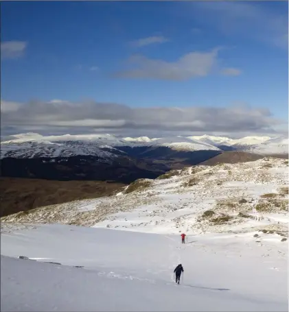  ??  ?? Hiking up the snowy ridge towards the summit of Cruach Ardrain in the Trossachs