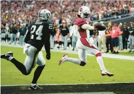  ?? JOHN LOCHER/AP ?? Cardinals QB Kyler Murray runs in for a TD as time expires in regulation Sunday against the Raiders. The Cardinals overcame a 20-point deficit and won the game in OT.