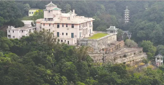  ?? LAURENT FIEVET/GETTY IMAGES ?? The Ho Tung Gardens residence on The Peak in Hong Kong. The Hong Kong government said it intended to declare one of its last colonial-era mansions a heritage site, despite objections from the wealthy heiress who owns the property.