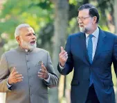  ?? — PTI ?? Prime Minister Narendra Modi with Spanish Premier Mariano Rajoy in the gardens of the Moncloa Palace in Madrid, Spain on Wednesday.