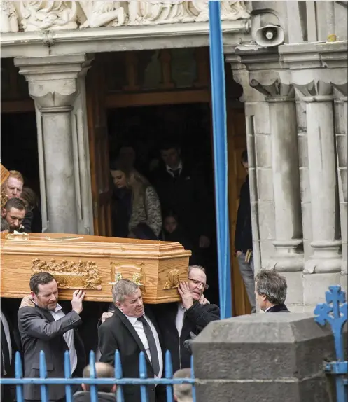  ??  ?? Relatives and friends carry the coffins of Christophe­r ‘ Sunny’ Harte and his son Sean Harte towards their final resting palce from the Cathedral of the Immaculate Conception following funeral mass last Wednesday.