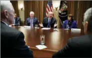  ?? CAROLYN KASTER — THE ASSOCIATED PRESS ?? President Donald Trump speaks in the Cabinet Room of the White House, in Washington, Wednesday during a meeting with members of congress to discuss school and community safety. With the president from left, Vice President Mike Pence, Sen. Chris Murphy,...